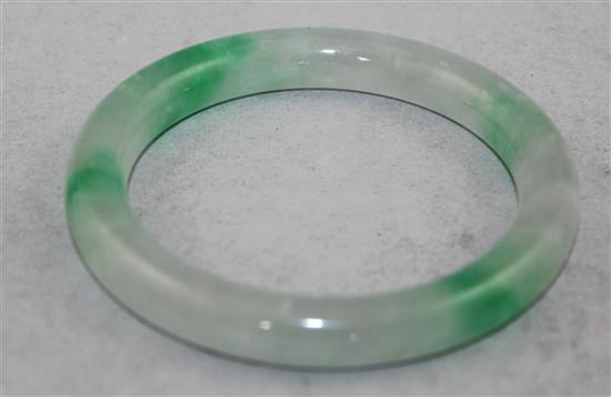 A Chinese ice white and emerald green jadeite bangle, 7.4cm.